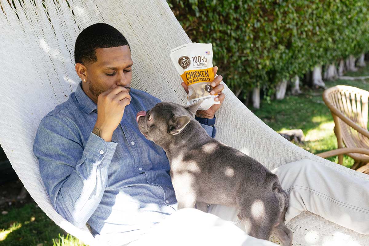 dog on hammock with human. safe human food for dogs