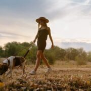 girl taking her dog on a sniff walk
