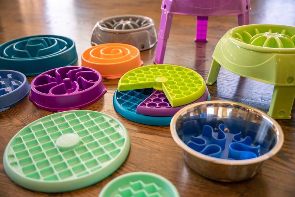 a display of many slow feeder dog toys